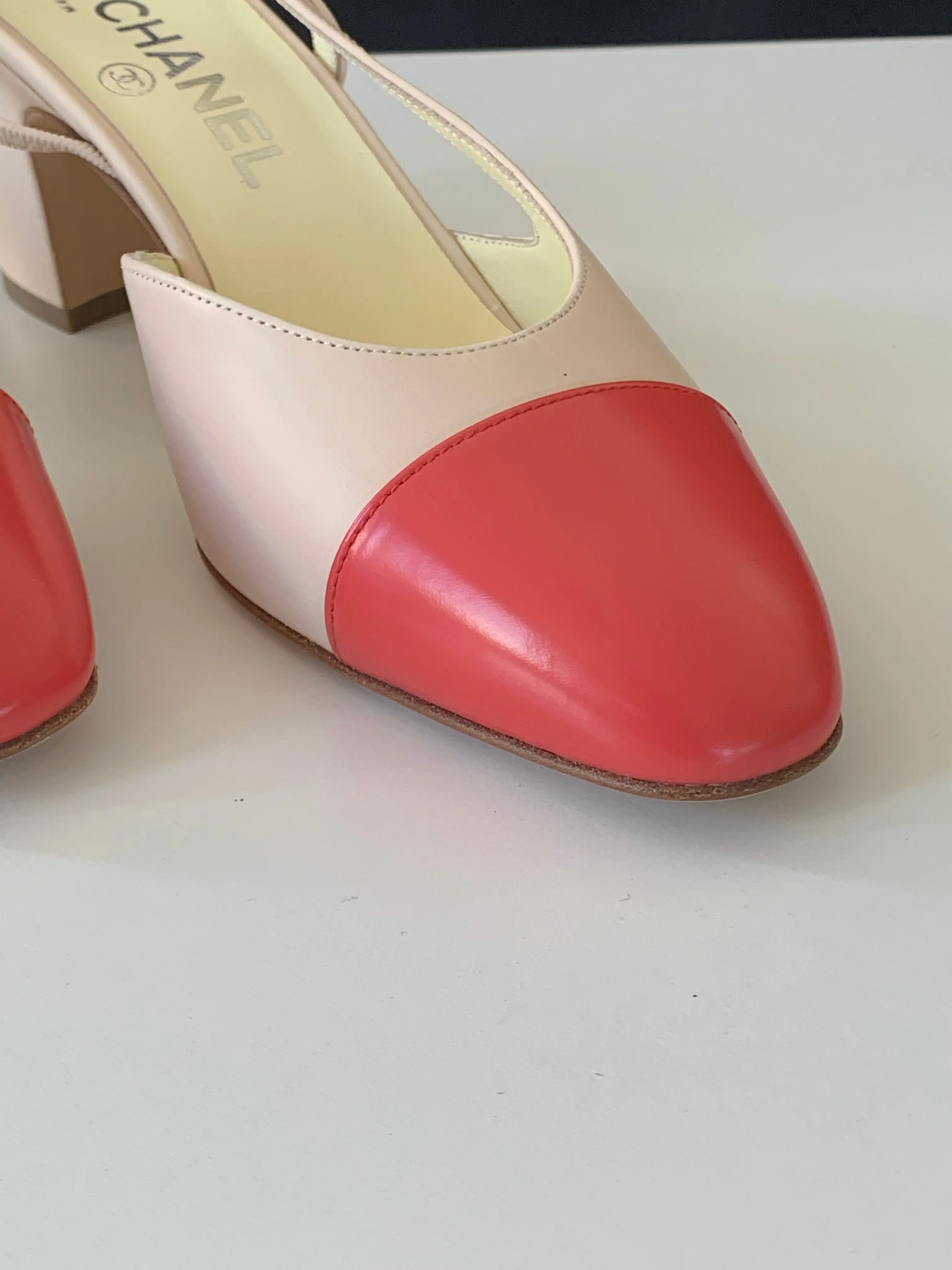 <b>CHANEL </b> <br>Cap Toe Slingback Pumps 38