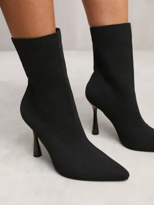 NELLOFER KNITTED HIGH HEEL ANKLE SOCK BOOTS WITH POINTED TOE IN BLACK